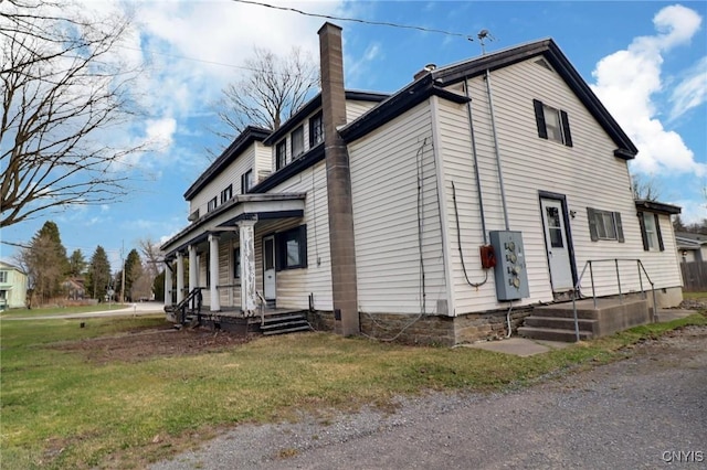 view of home's exterior with a lawn and a chimney