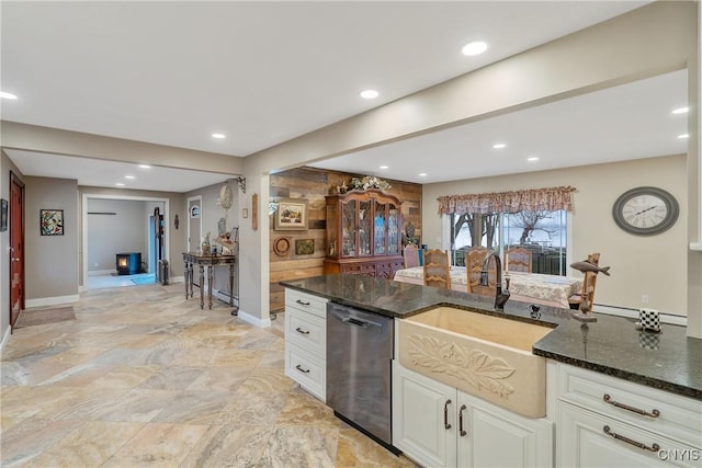 20 Youman Rd, Constantia, NY 13028 - kitchen featuring dishwasher, dark stone countertops, a sink, baseboards, and recessed lighting