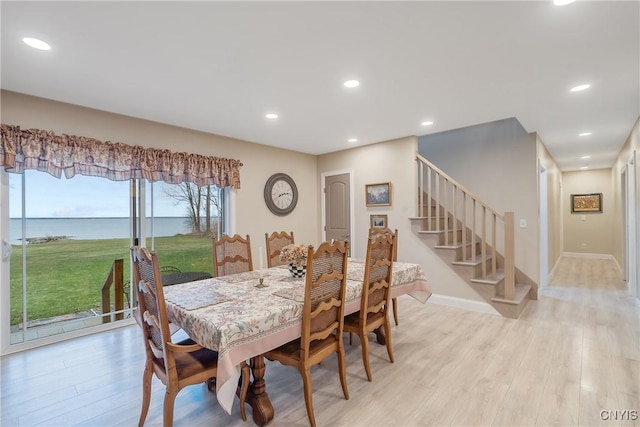 20 Youman Rd, Constantia, NY 13028 - dining area featuring light wood-style flooring, stairs, recessed lighting, and baseboards