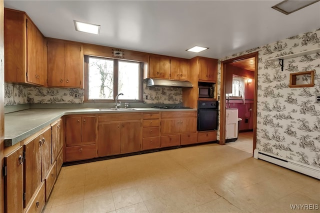11765 Maple Ridge Rd, Shelby, NY 14103 - kitchen with wallpapered walls, under cabinet range hood, a sink, and black appliances
