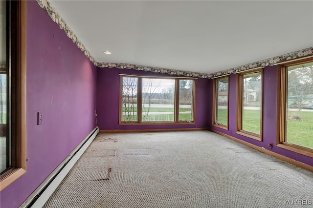 11765 Maple Ridge Rd, Shelby, NY 14103 - carpeted empty room with baseboards, baseboard heating, and plenty of natural light