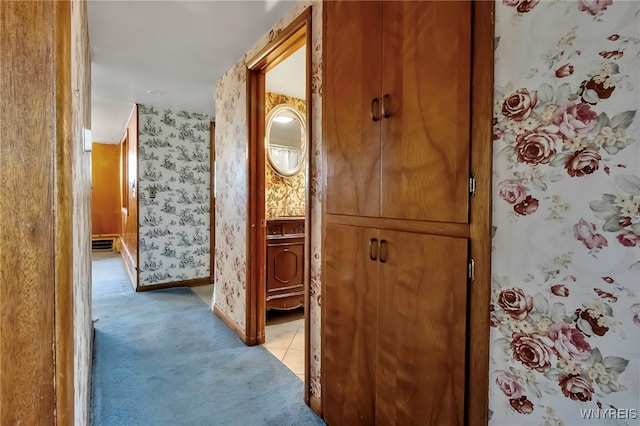 11765 Maple Ridge Rd, Shelby, NY 14103 - corridor with wallpapered walls, light tile patterned floors, baseboards, and light colored carpet