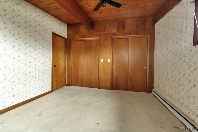 11765 Maple Ridge Rd, Shelby, NY 14103 - unfurnished bedroom featuring beamed ceiling, carpet, wallpapered walls, a baseboard heating unit, and wooden ceiling