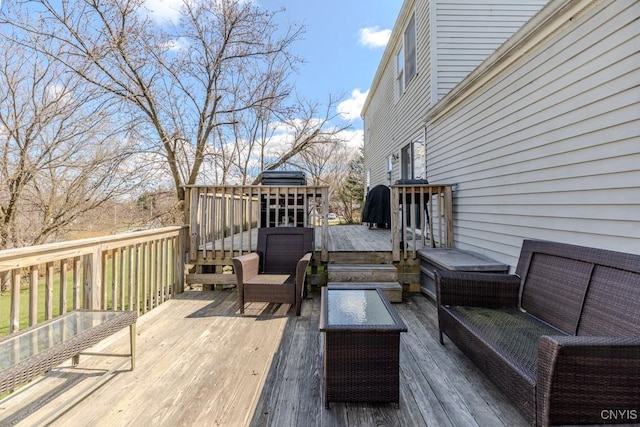 wooden terrace featuring outdoor lounge area