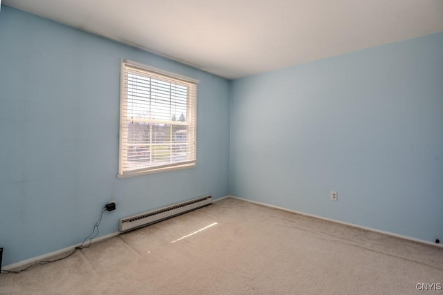 carpeted empty room with a baseboard radiator