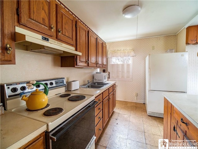 111 Springdale, Jamestown, NY 14701 - kitchen featuring light countertops, white appliances, under cabinet range hood, wallpapered walls, and a sink