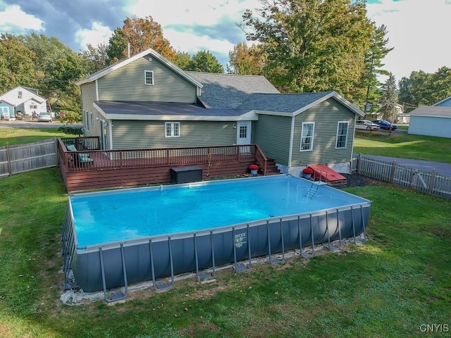 4973 Wilder Rd, Ellisburg, NY 13605 - rear view of house featuring a lawn, a fenced in pool, a wooden deck, and a fenced backyard