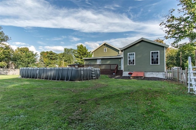 4973 Wilder Rd, Ellisburg, NY 13605 - view of yard featuring fence, a swimming pool, and a deck
