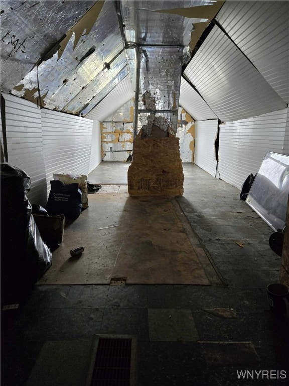 miscellaneous room with lofted ceiling