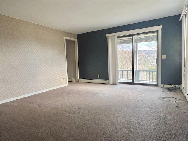 empty room with baseboards, wallpapered walls, and a baseboard heating unit