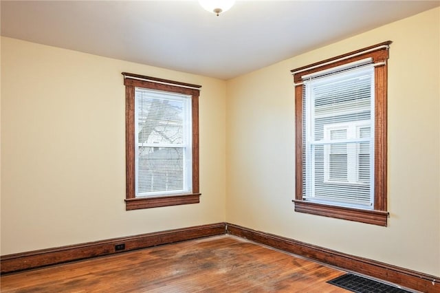 179 S W St, Geneva-City, NY 14456 - empty room featuring baseboards, visible vents, and wood finished floors
