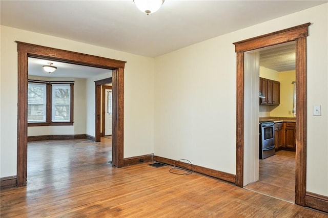 179 S W St, Geneva-City, NY 14456 - spare room featuring baseboards and light wood-type flooring