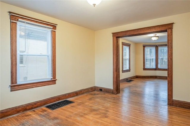 179 S W St, Geneva-City, NY 14456 - empty room with plenty of natural light, baseboards, light wood-style floors, and visible vents