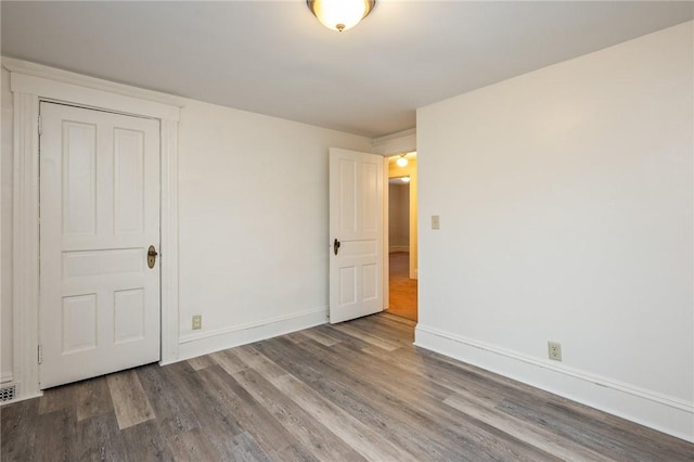 179 S W St, Geneva-City, NY 14456 - spare room with baseboards and wood finished floors