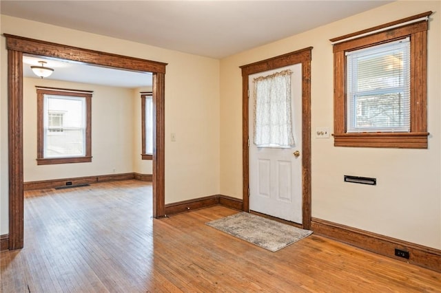 179 S W St, Geneva-City, NY 14456 - foyer entrance featuring baseboards and light wood-style floors