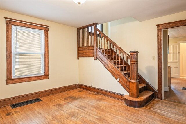 179 S W St, Geneva-City, NY 14456 - stairs featuring hardwood / wood-style floors, baseboards, and visible vents