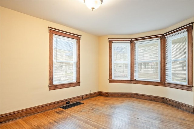 179 S W St, Geneva-City, NY 14456 - empty room featuring baseboards, visible vents, and wood finished floors