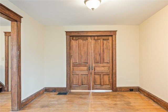 179 S W St, Geneva-City, NY 14456 - unfurnished bedroom with baseboards, light wood-type flooring, and visible vents