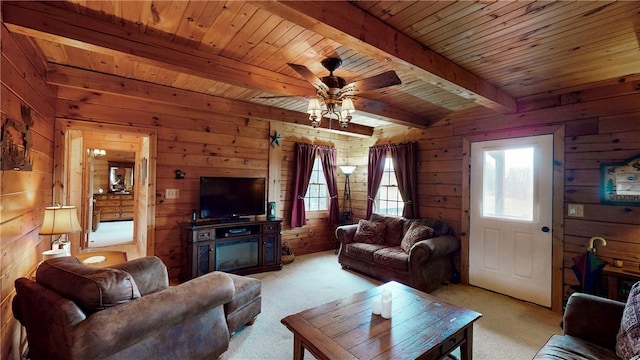 7061 Velie Rd, Bath, NY 14879 - living area with beamed ceiling, wooden walls, wooden ceiling, and ceiling fan