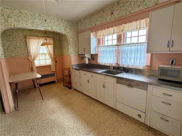 174 N Bennett St, Bradford-City, PA 16701 - kitchen with wallpapered walls, a sink, plenty of natural light, dishwasher, and stainless steel counters