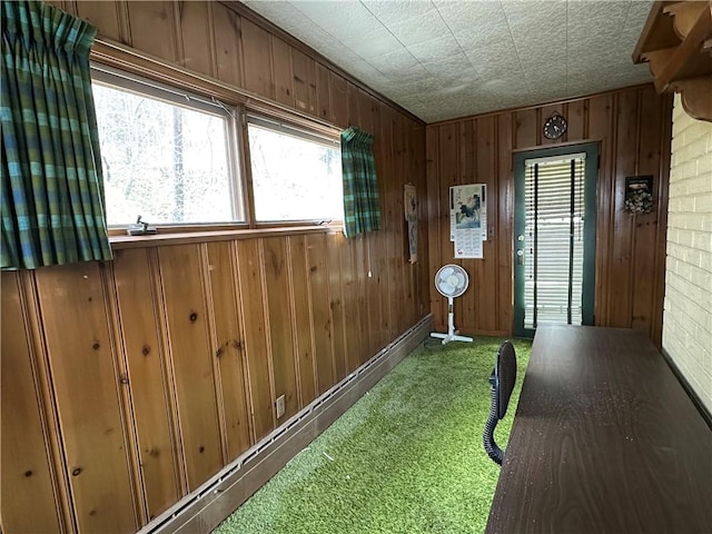 174 N Bennett St, Bradford-City, PA 16701 - interior space with carpet floors, wooden walls, and healthy amount of natural light