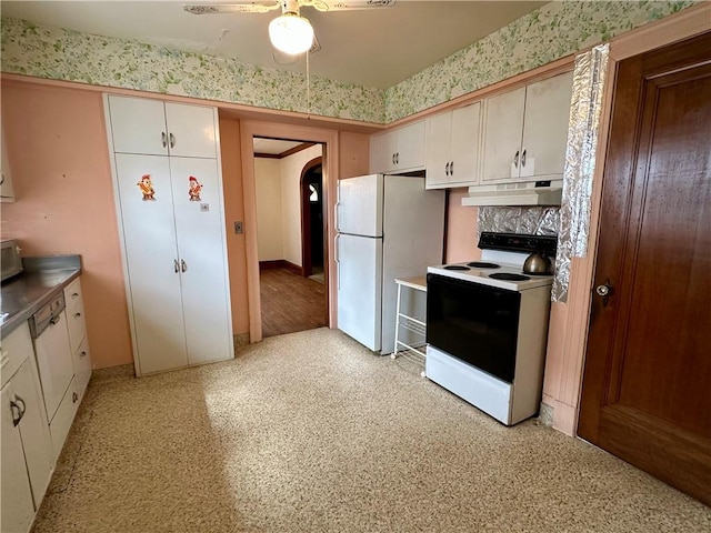 174 N Bennett St, Bradford-City, PA 16701 - kitchen with range with electric cooktop, under cabinet range hood, freestanding refrigerator, arched walkways, and white cabinets