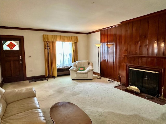 174 N Bennett St, Bradford-City, PA 16701 - living area with a fireplace with flush hearth, ornamental molding, carpet floors, baseboards, and wooden walls