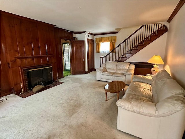 174 N Bennett St, Bradford-City, PA 16701 - living room with ornamental molding, stairway, wood walls, carpet floors, and a fireplace