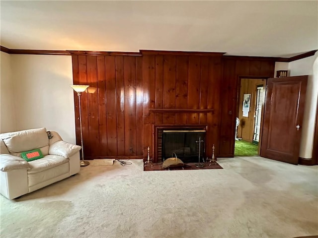 174 N Bennett St, Bradford-City, PA 16701 - living area with ornamental molding, carpet flooring, wooden walls, a brick fireplace, and baseboards