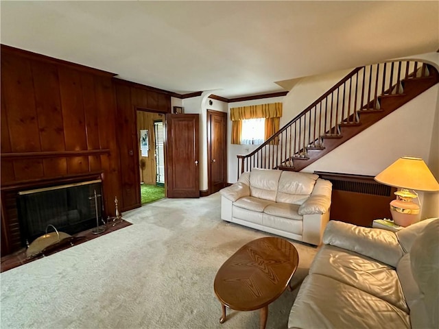 174 N Bennett St, Bradford-City, PA 16701 - carpeted living room with stairway, crown molding, a fireplace with flush hearth, and wooden walls