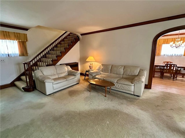 174 N Bennett St, Bradford-City, PA 16701 - living area featuring a chandelier, stairway, arched walkways, carpet, and baseboards