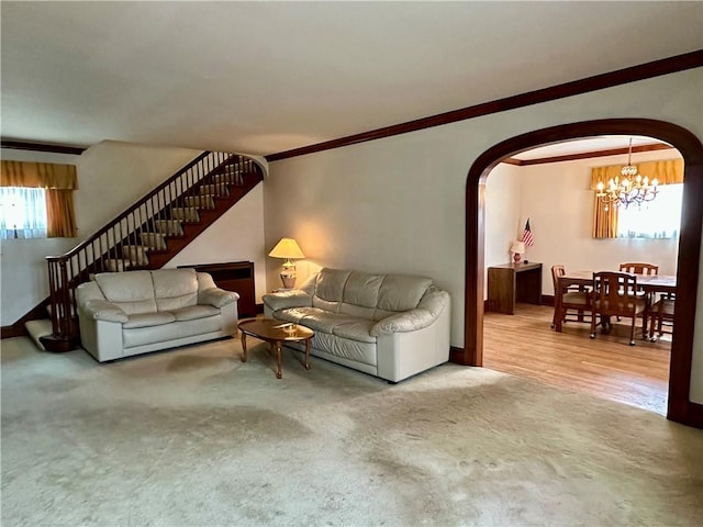 174 N Bennett St, Bradford-City, PA 16701 - carpeted living area featuring arched walkways, a chandelier, stairway, and crown molding