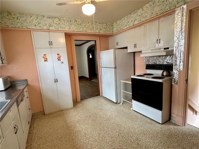 174 N Bennett St, Bradford-City, PA 16701 - kitchen featuring electric range, under cabinet range hood, freestanding refrigerator, arched walkways, and white cabinets