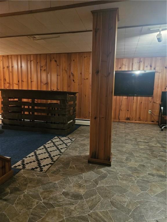 305 State St, Smethport-Borough, PA 16749 - bonus room with stone floors, a baseboard heating unit, and wooden walls