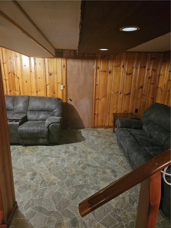 305 State St, Smethport-Borough, PA 16749 - living room with stone flooring and wooden walls