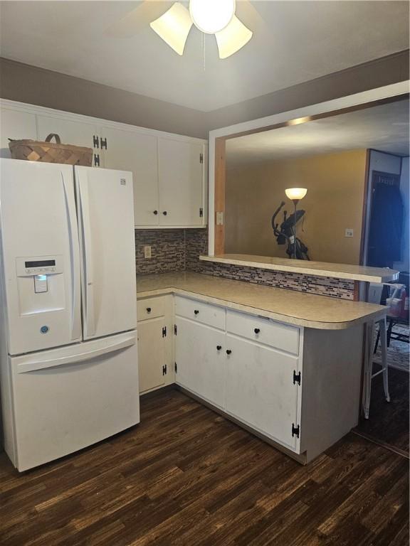 305 State St, Smethport-Borough, PA 16749 - kitchen with light countertops, white fridge with ice dispenser, a peninsula, and dark wood finished floors