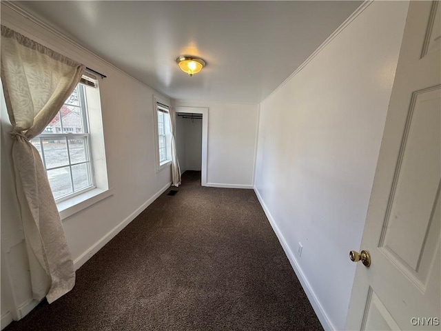 318 Academy St, Watertown-City, NY 13601 - spare room with dark carpet and baseboards
