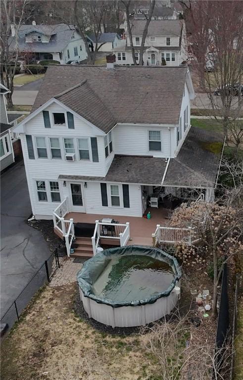 114 Country Club Dr, Elmira, NY 14905 - back of property with a shingled roof, fence, a wooden deck, and a residential view