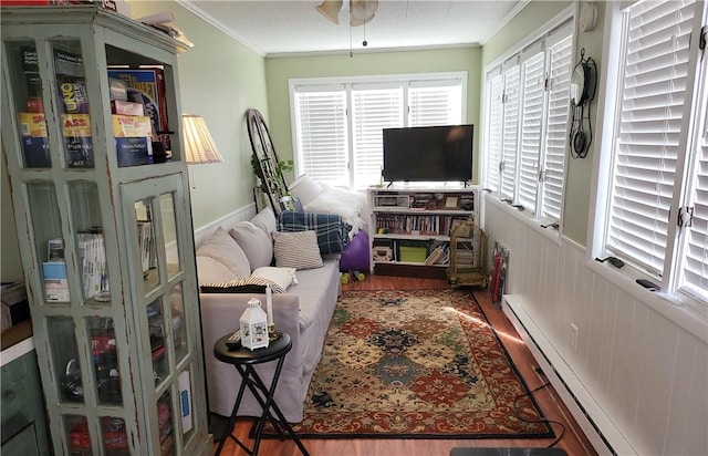 114 Country Club Dr, Elmira, NY 14905 - living area with a wainscoted wall, crown molding, a baseboard radiator, ceiling fan, and wood finished floors