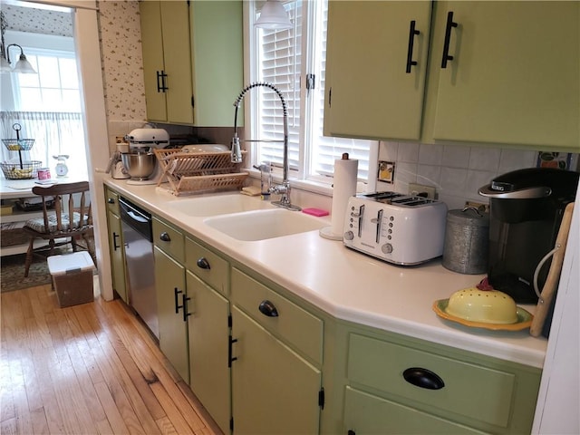114 Country Club Dr, Elmira, NY 14905 - kitchen with light countertops, tasteful backsplash, a sink, light wood-style floors, and dishwasher