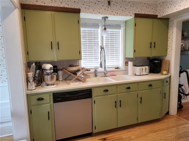 114 Country Club Dr, Elmira, NY 14905 - kitchen featuring green cabinetry, light countertops, a sink, dishwasher, and light wood-style floors
