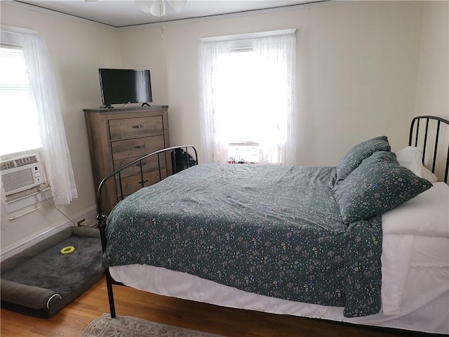 114 Country Club Dr, Elmira, NY 14905 - bedroom featuring cooling unit, baseboards, and wood finished floors