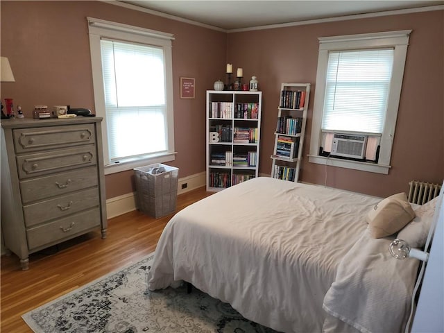 114 Country Club Dr, Elmira, NY 14905 - bedroom with radiator heating unit, ornamental molding, baseboards, and light wood finished floors