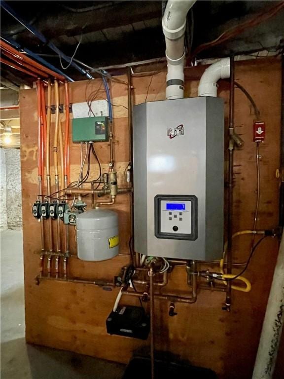 utility room with water heater