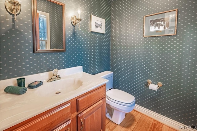7131 Lakeshore Ter, Newfane, NY 14008 - bathroom with toilet, wallpapered walls, and wood finished floors