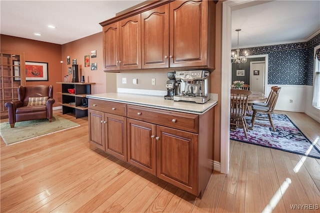 7131 Lakeshore Ter, Newfane, NY 14008 - kitchen with brown cabinetry, recessed lighting, light wood finished floors, light countertops, and a notable chandelier