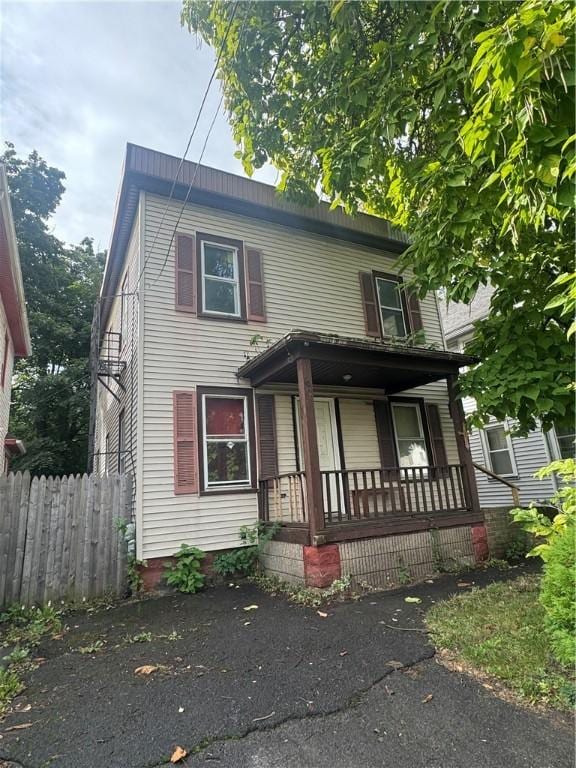 659 Bay St, Rochester, NY 14609 - view of front of house with a porch and fence