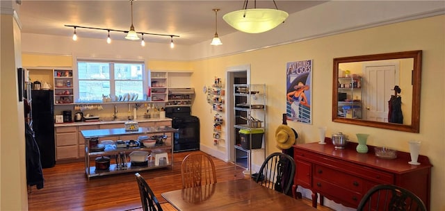 dining room featuring dark wood-style floors