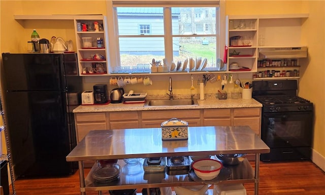 kitchen featuring a sink, open shelves, under cabinet range hood, black appliances, and dark wood-style flooring