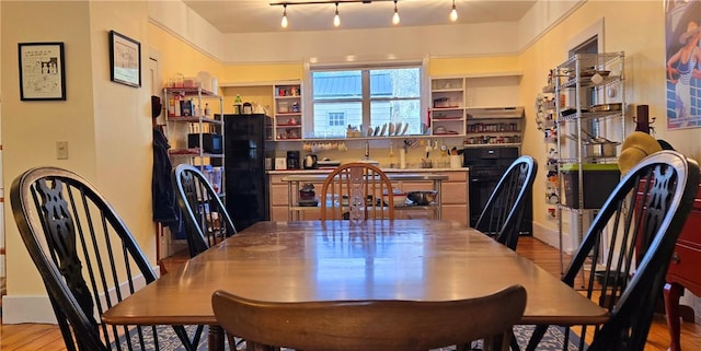 dining room with light wood finished floors